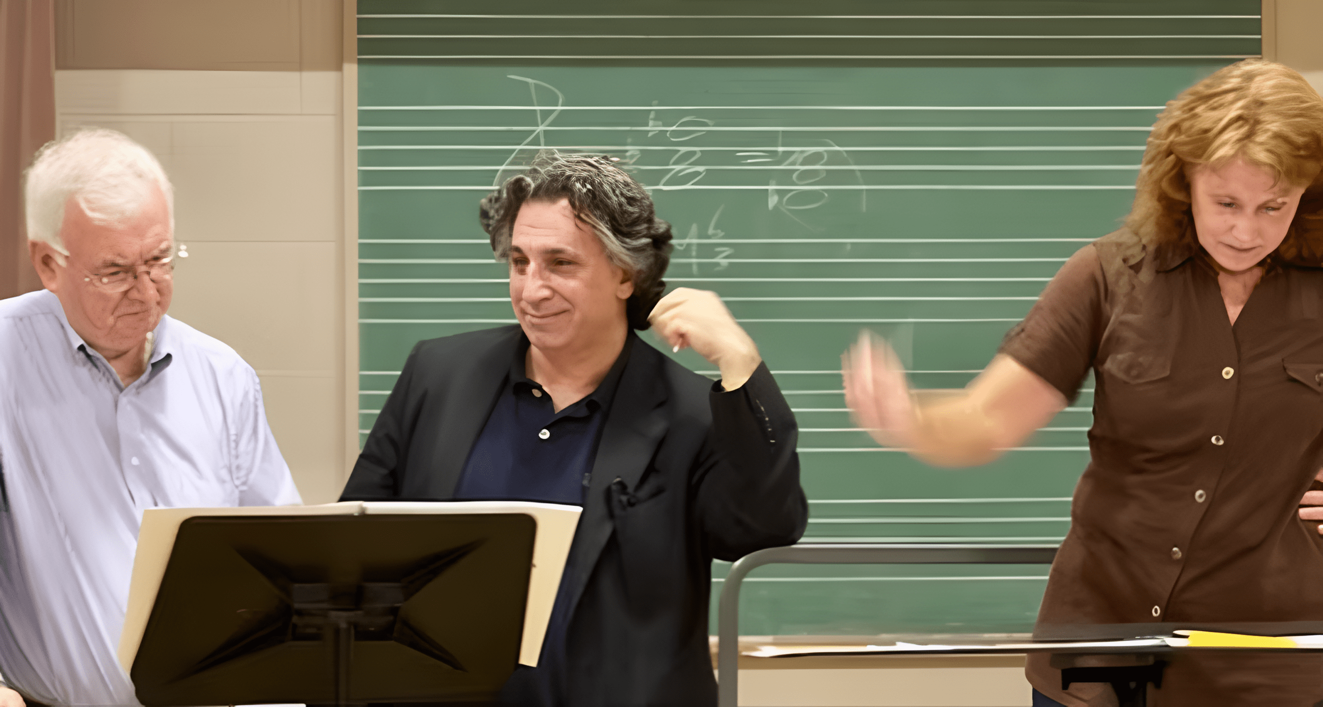 People discussing in music classroom setting